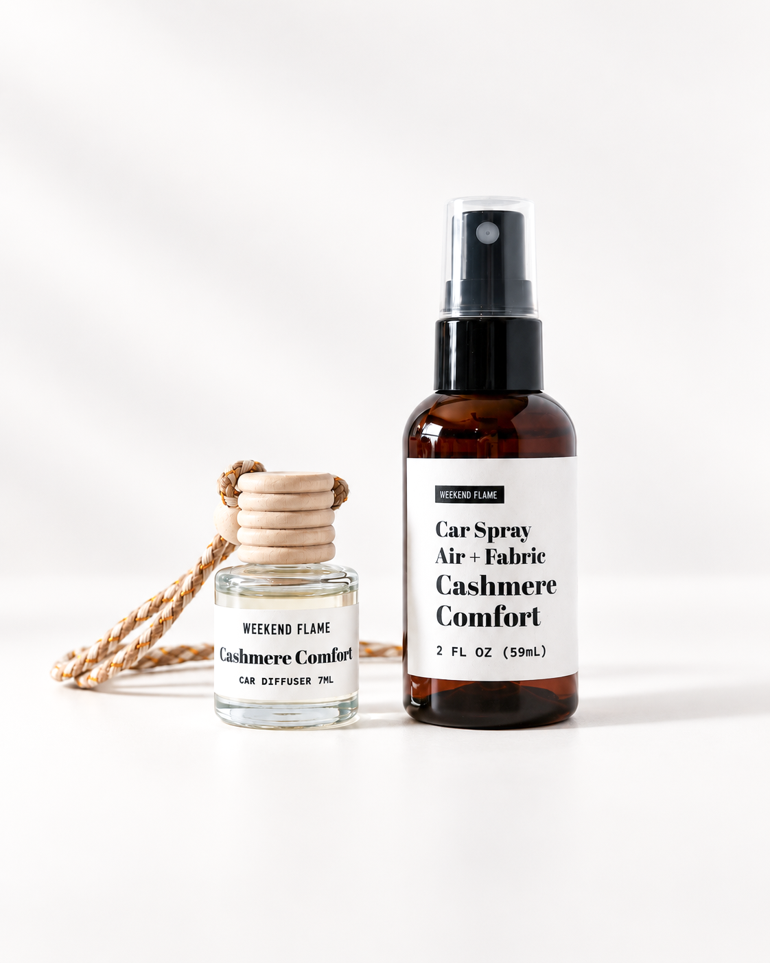 A car spray air freshener bottle and a small diffuser flame bottle, both labeled 'WEEKEND FLAME Cashmere Comfort,' on a clean white background.