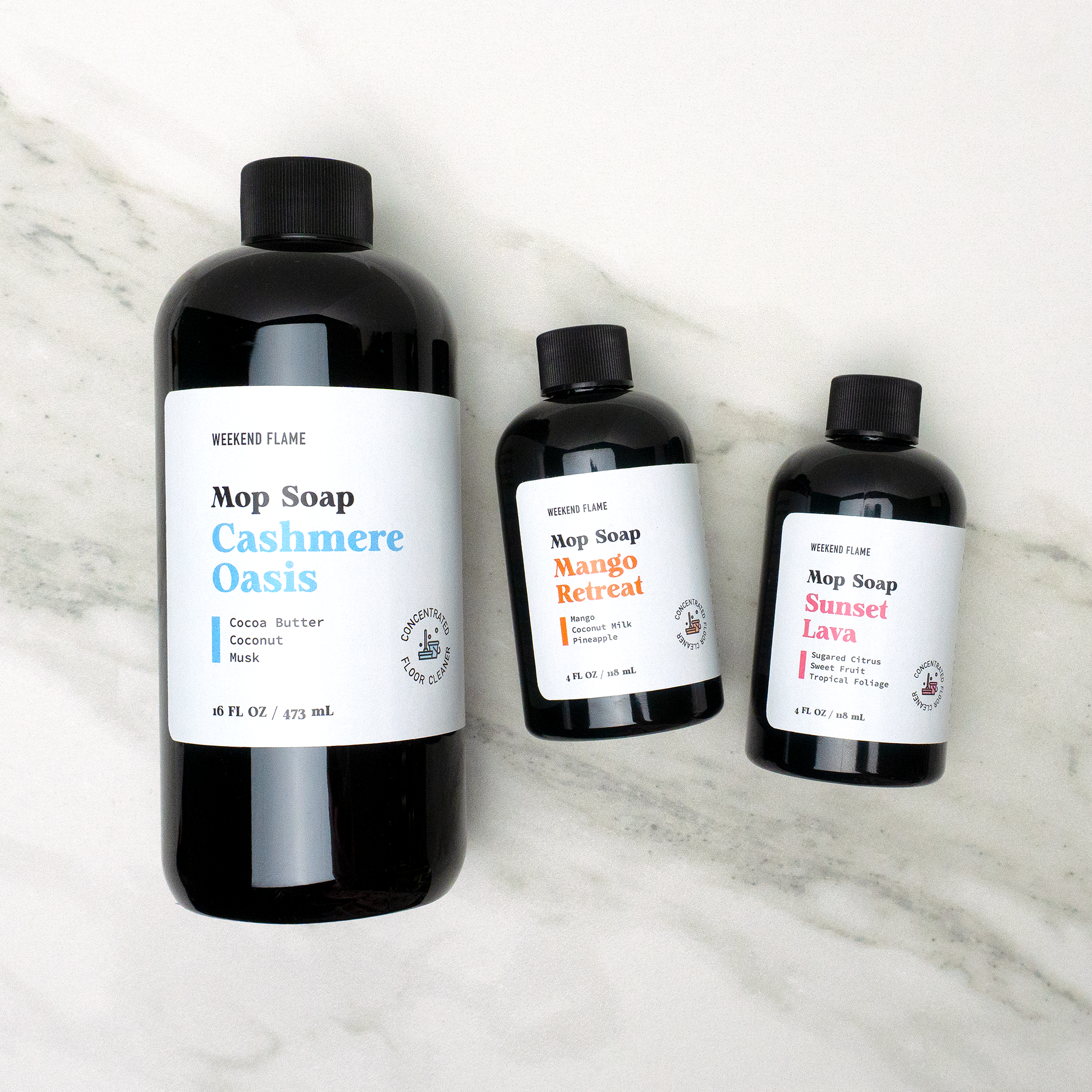 Set of three scented mop soap bottles in various fragrances, displayed side by side with stylish, minimal labels.