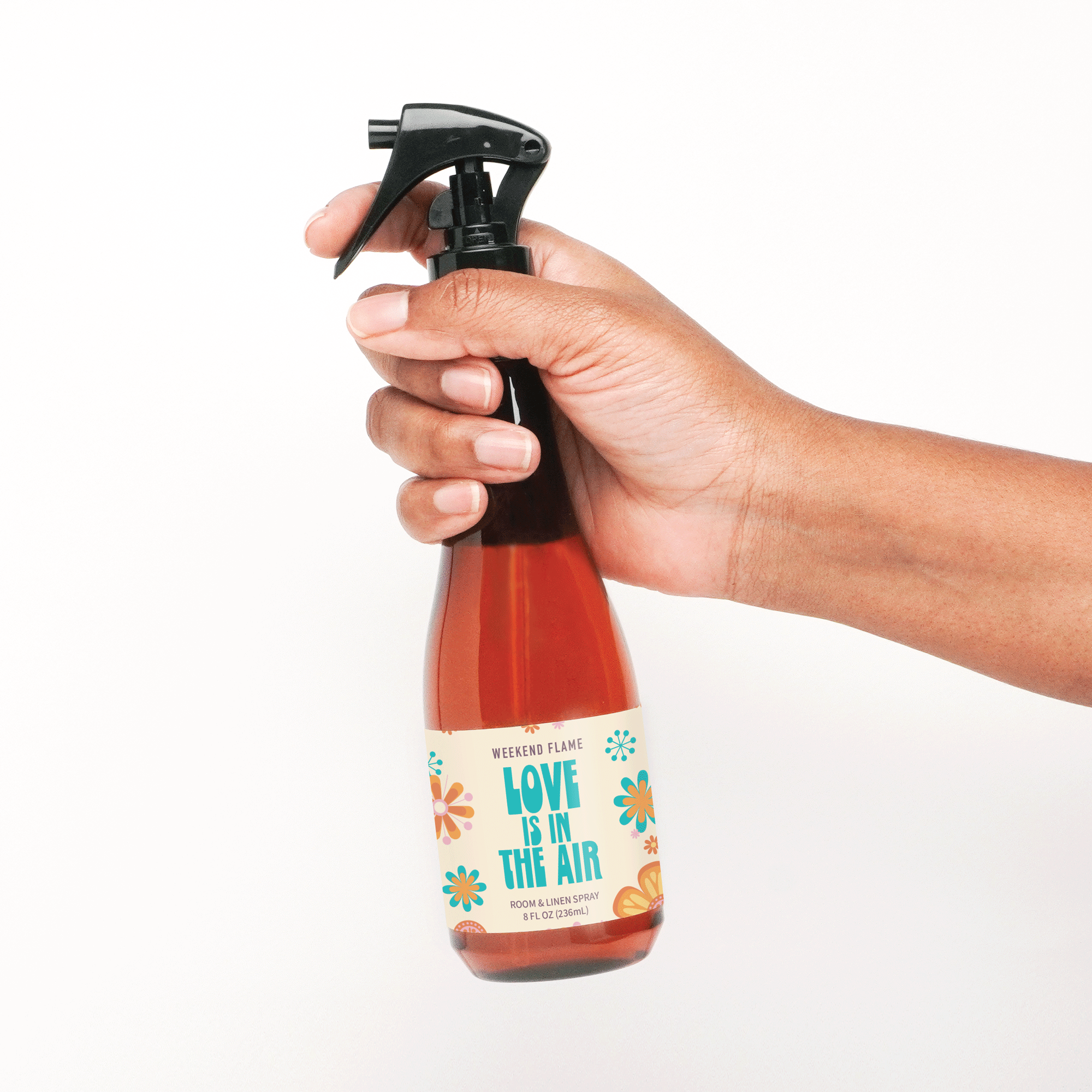 Love is in the air valentines day room and linen spray in amber bottle with black trigger sprayer