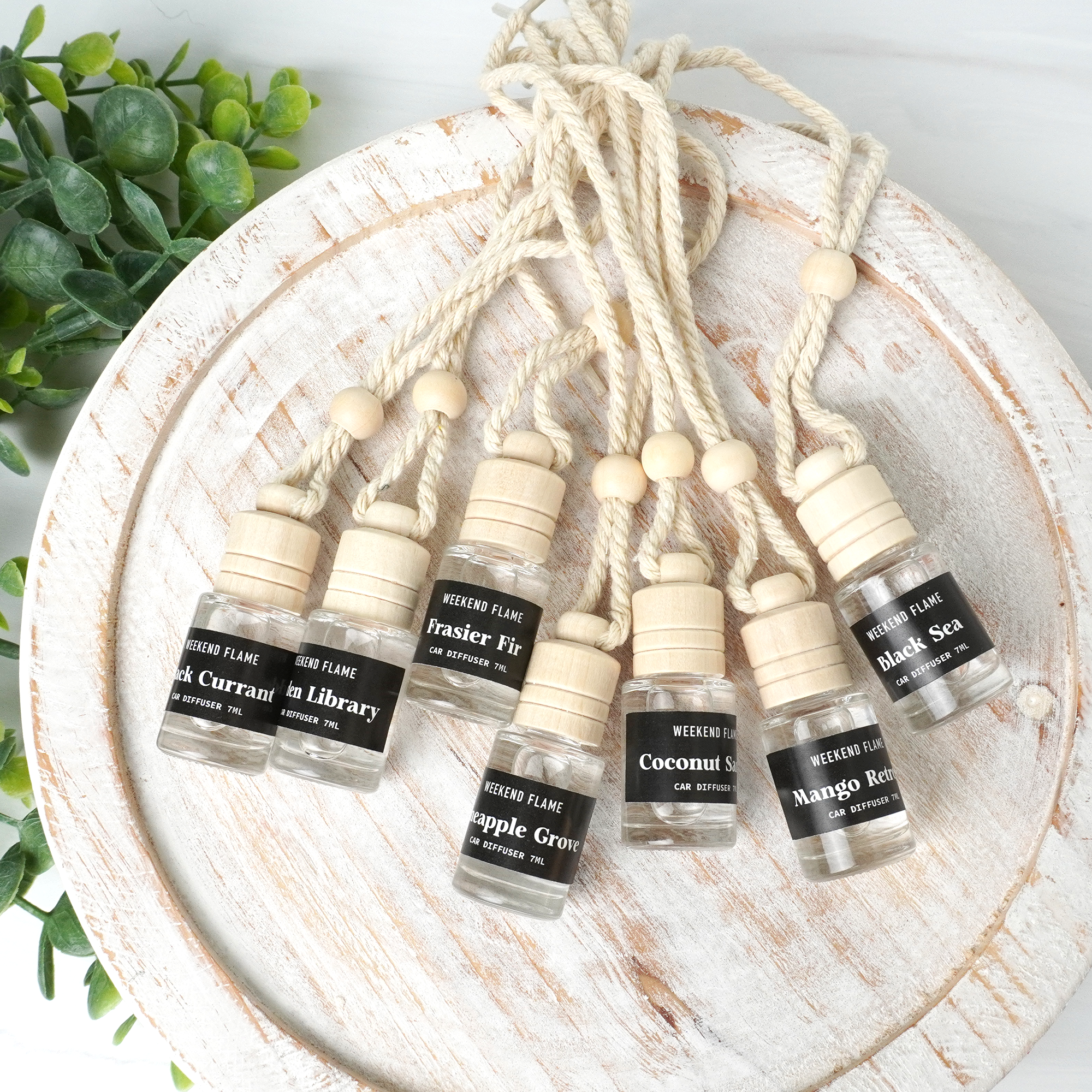 Shop scented hanging car air fresheners of various scents.