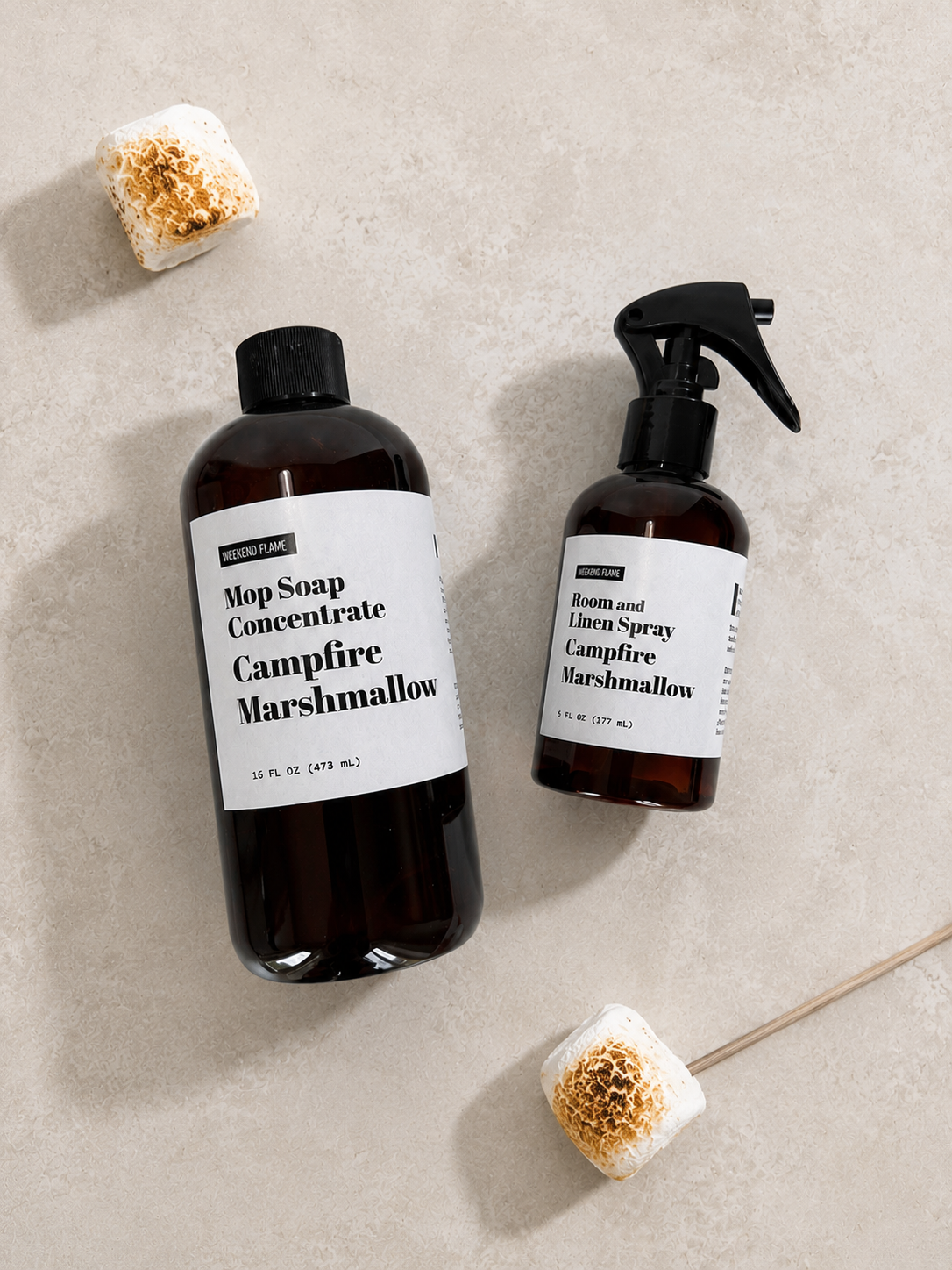 Toasted Marshmallow Mop Soap Concentrate and Room and Linen Spray in amber bottles displayed together as a home fragrance cleaning collection